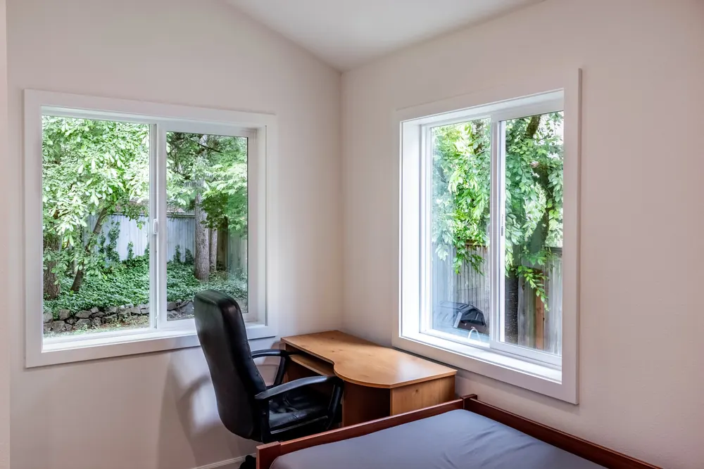 Bedroom corner with windows on two walls