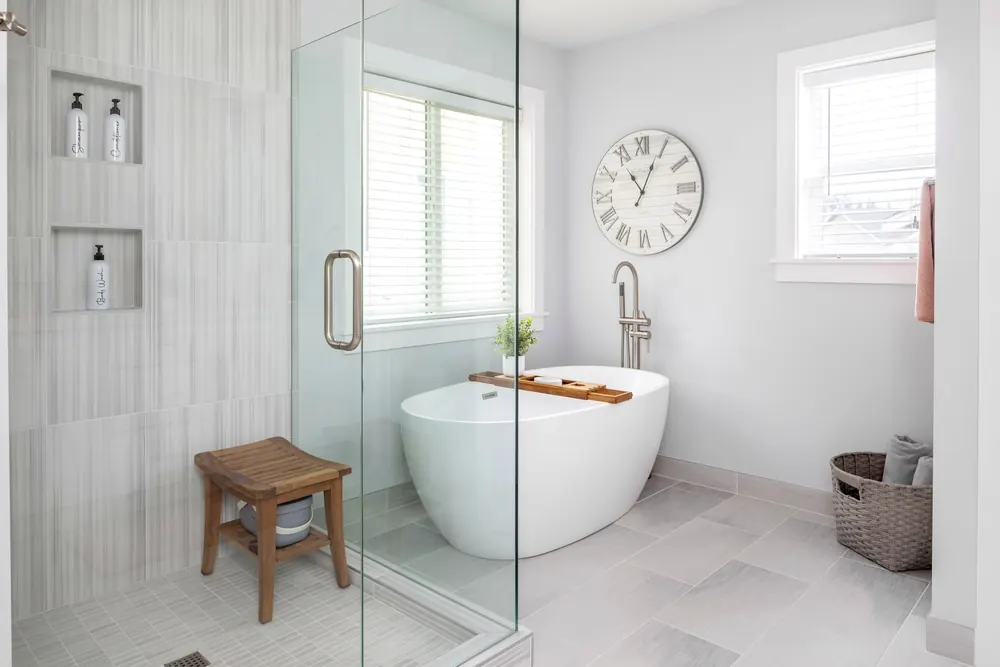 Freestanding tub beside a glass shower