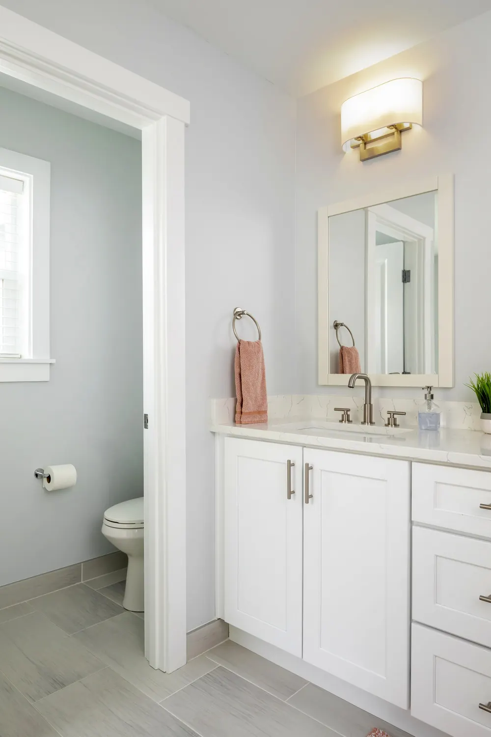 Vanity and toilet in the remodeled bath