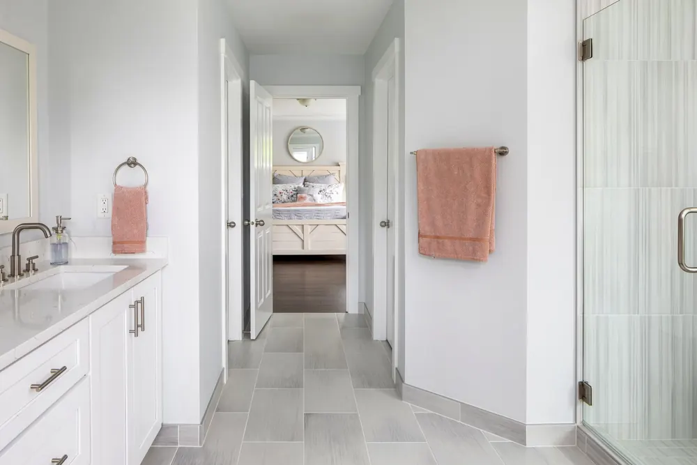 Long vanity with a view down the hall