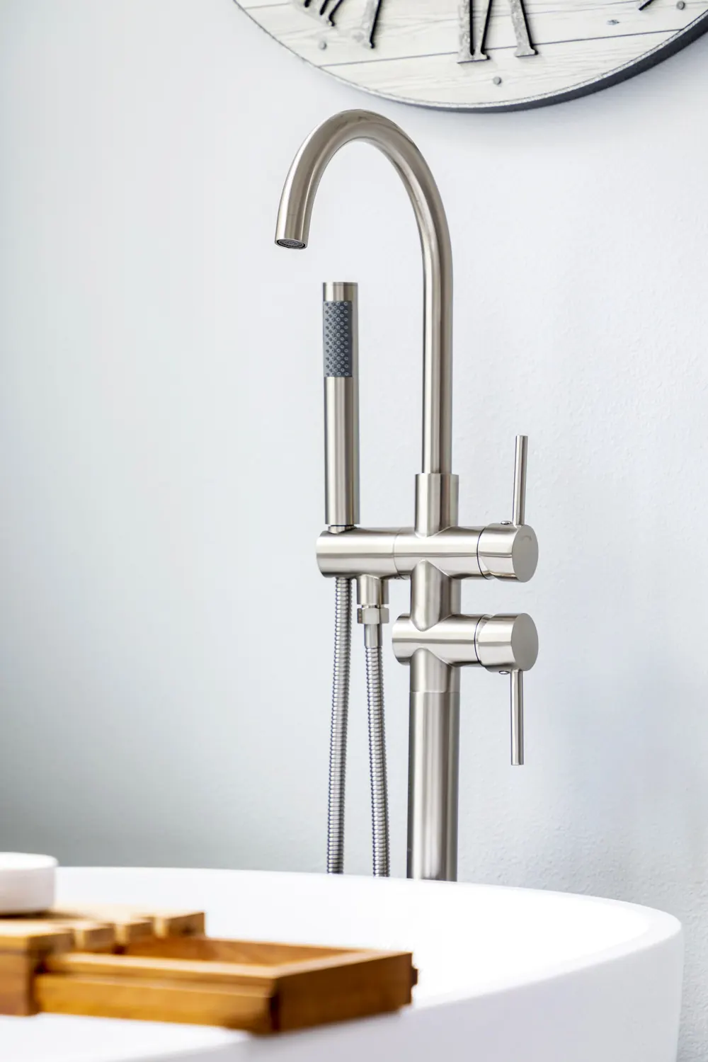 Freestanding tub filler in brushed nickel