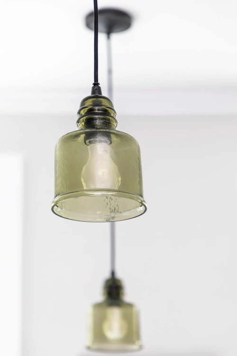 Glass pendant lights over the island
