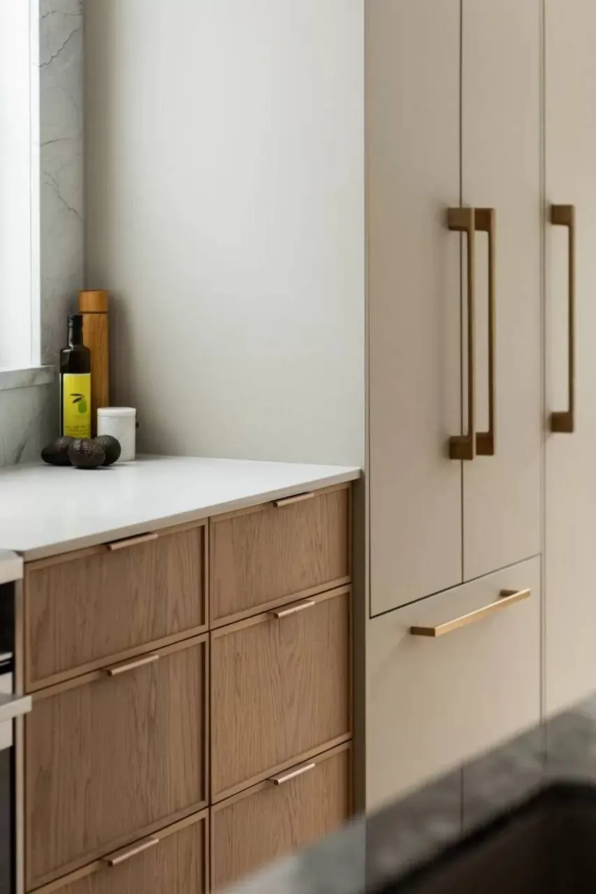 Wood drawers and tall cabinets with brass pulls