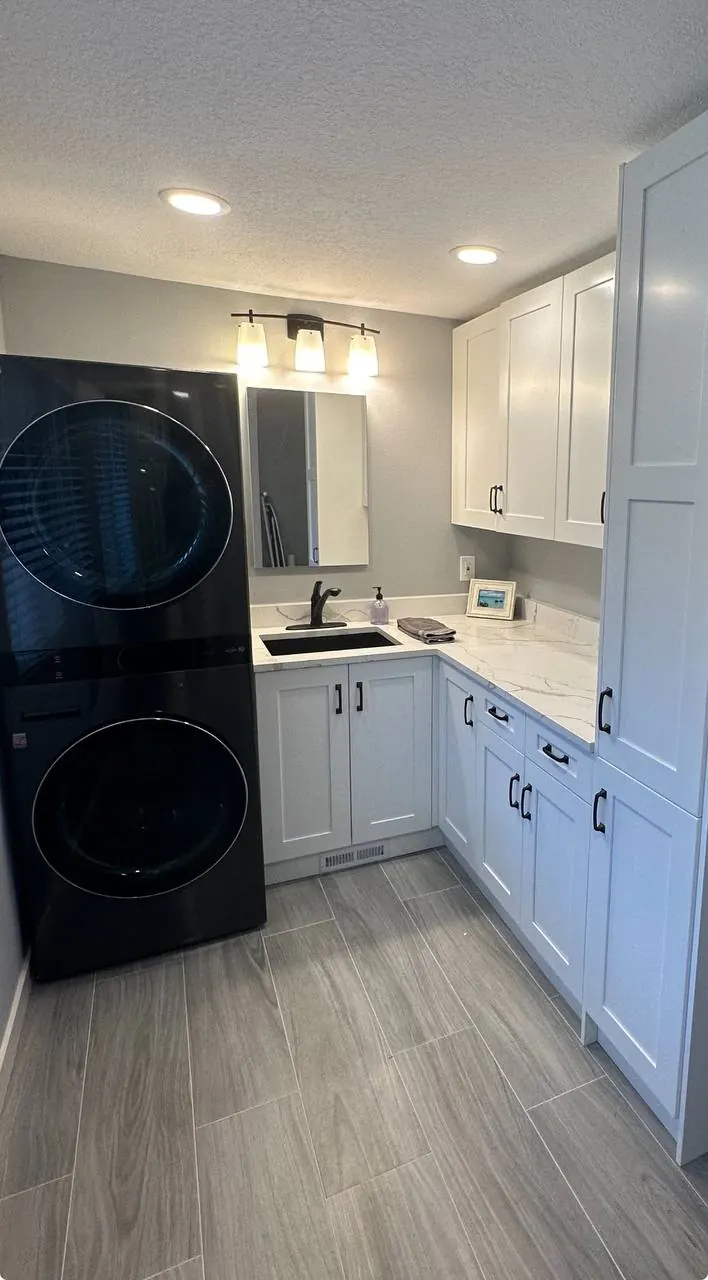 Laundry and kitchenette with white shaker cabinets