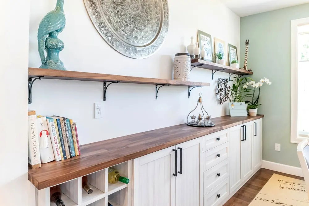 Built-in base cabinets with a wood top and open shelving
