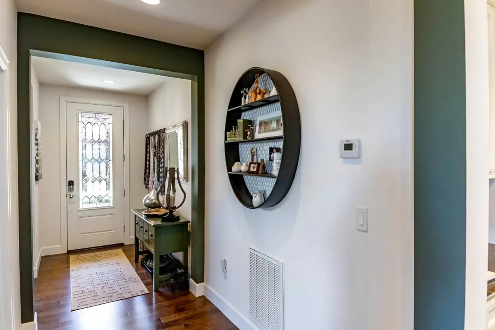 Hallway with a round wall shelf