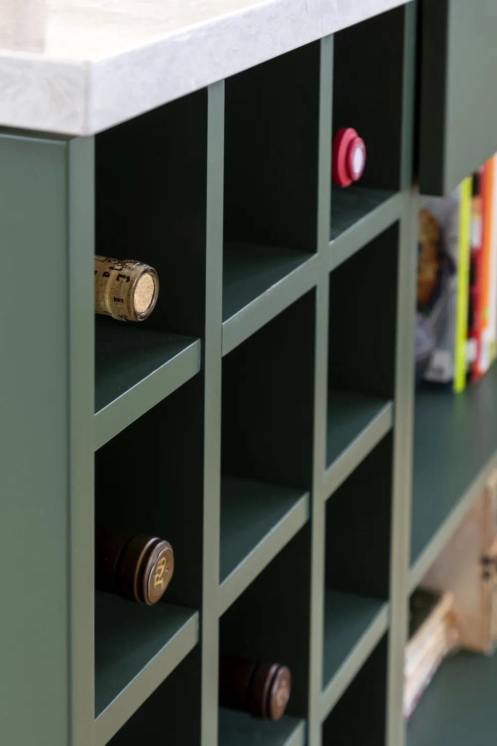 Wine cubbies built into the green island