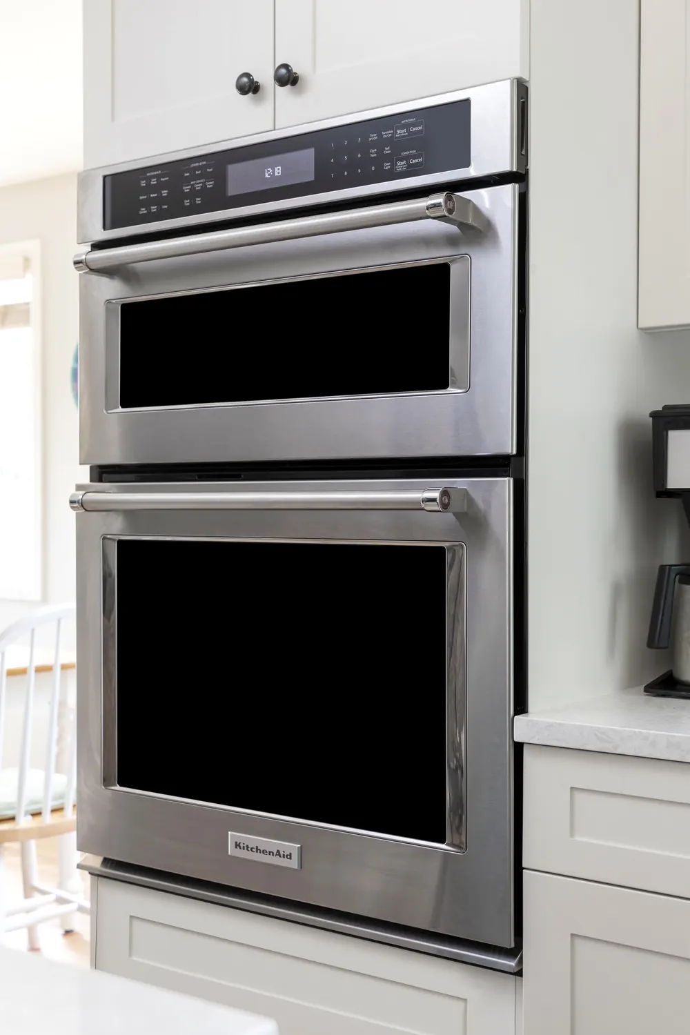 Double wall ovens set in white cabinetry