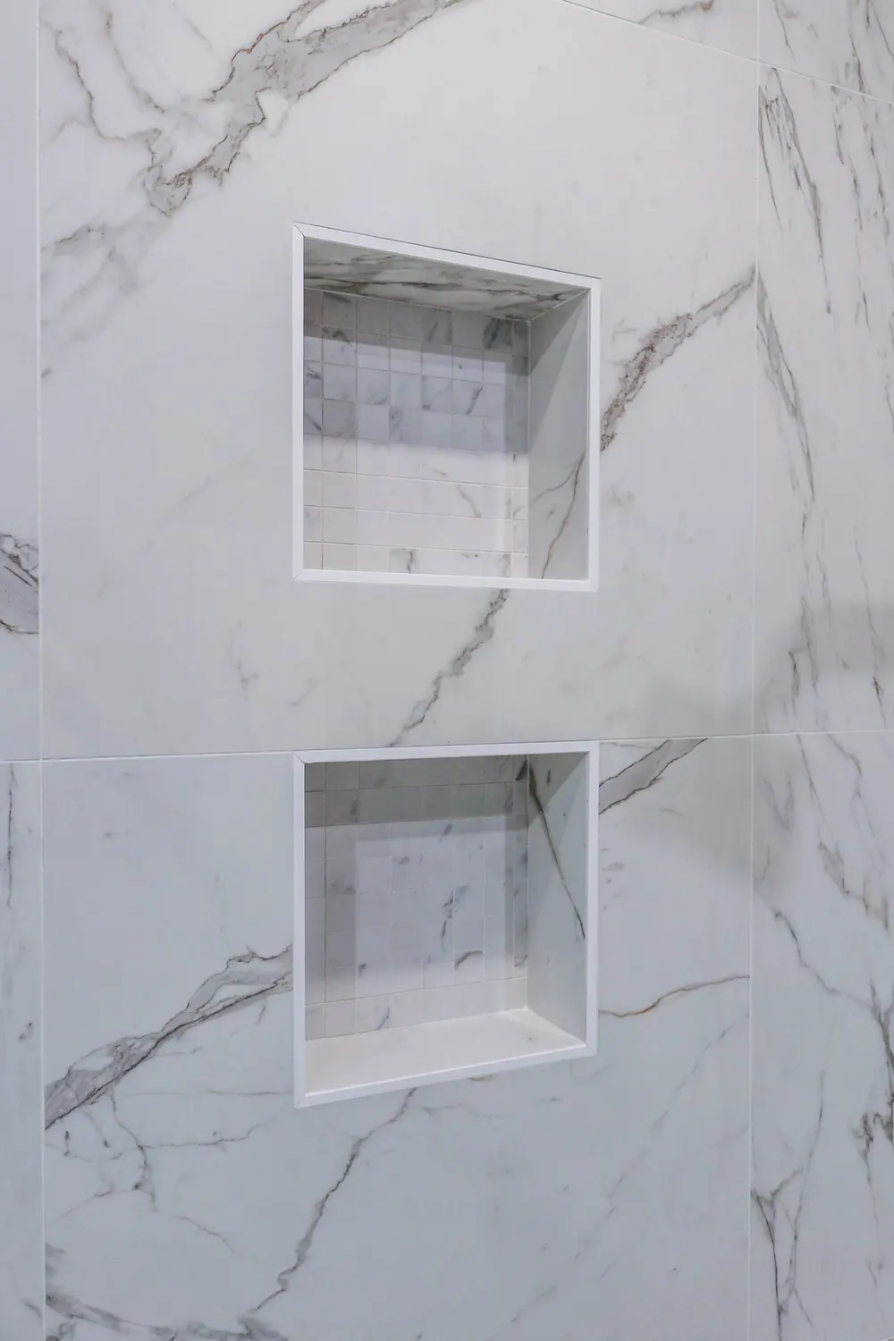 Two stacked shower niches