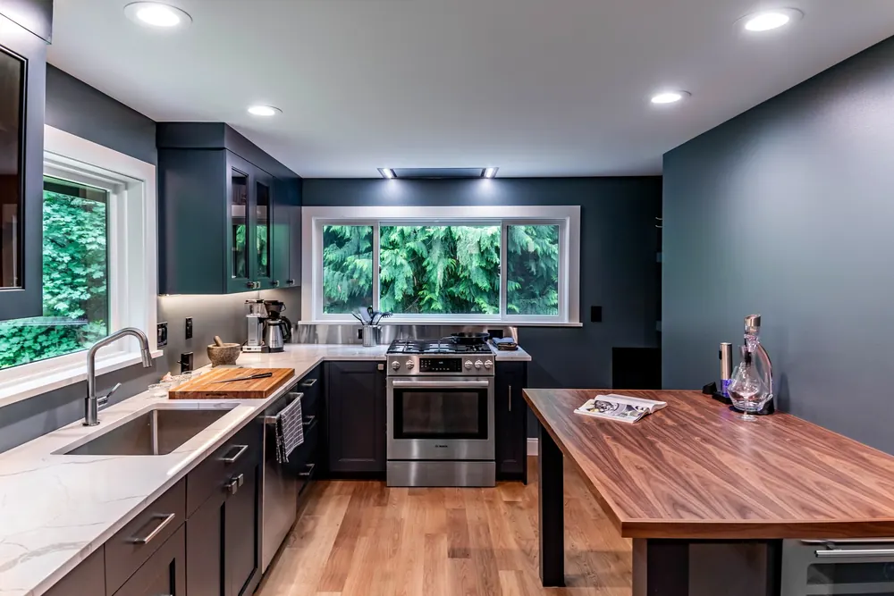 Navy kitchen cabinets and butcher-block island
