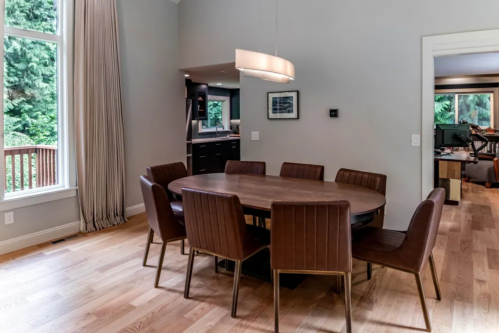 Dining room with a round table under a pendant light