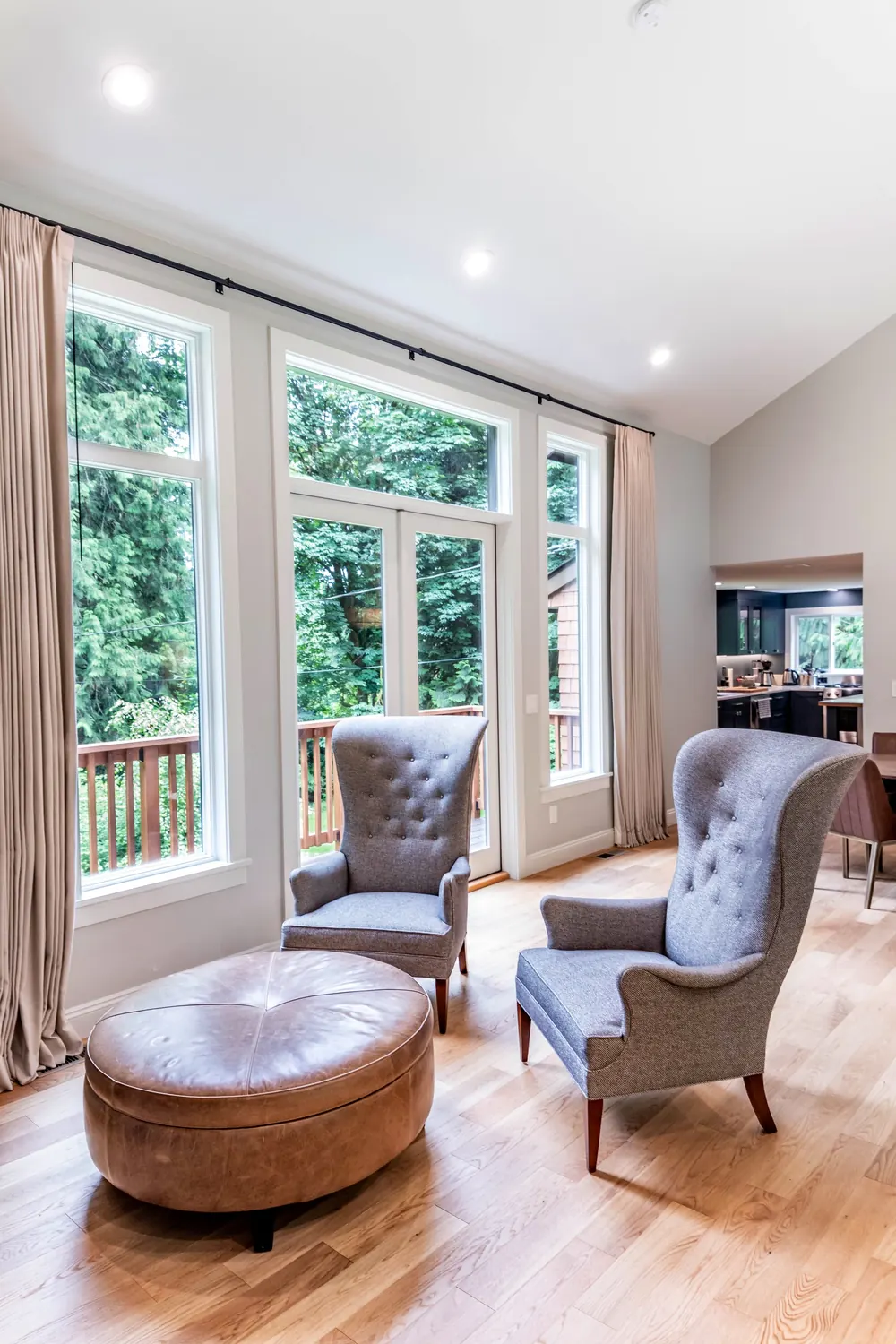 Sitting area with armchairs by French doors