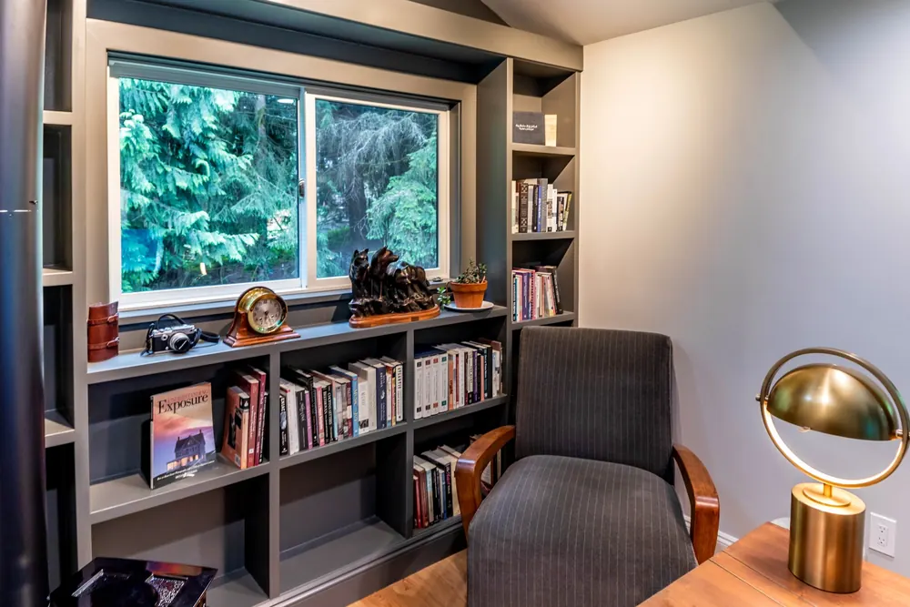 Built-in bookshelves around a picture window
