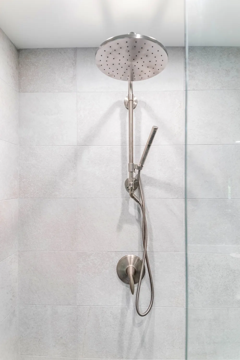 Rain shower head over light tile