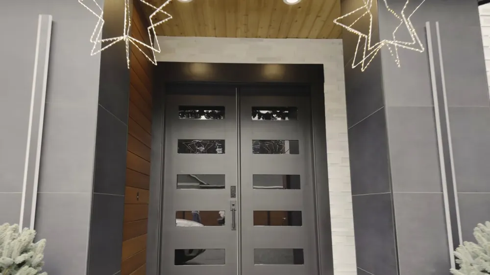 Front entry with dark double doors and glass inserts