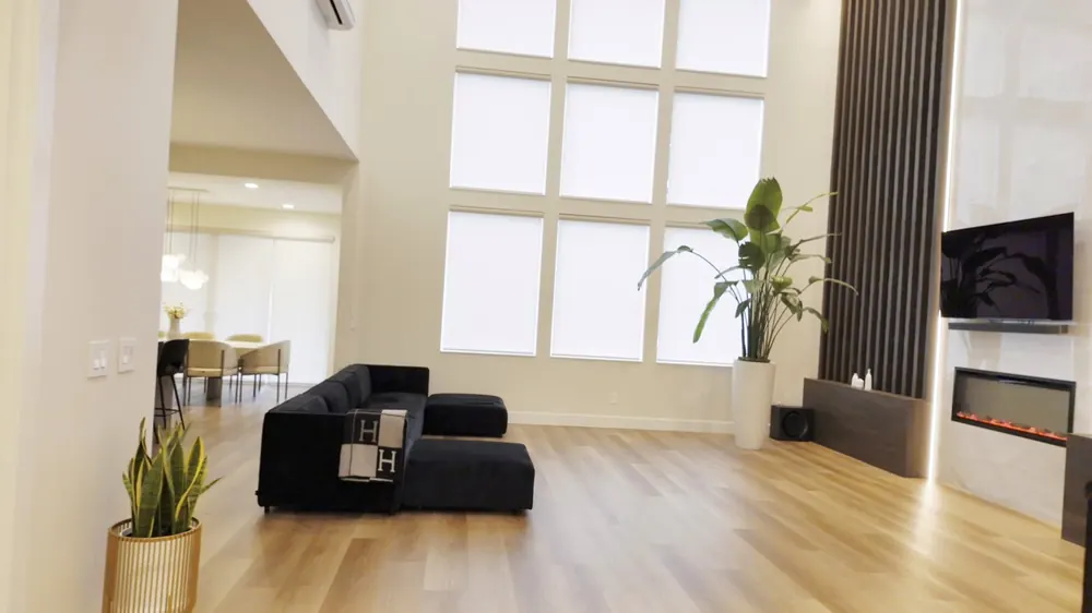 Double-height living room with tall windows