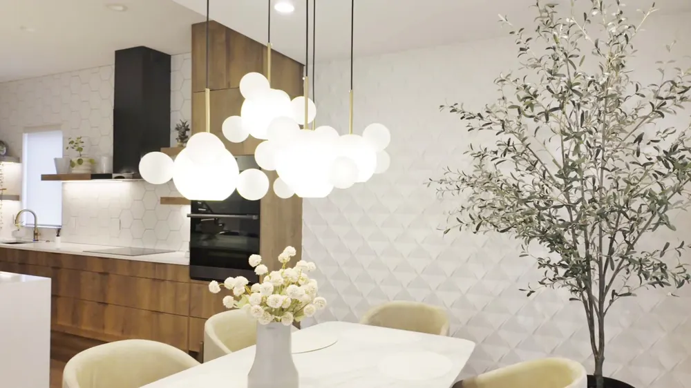 Open kitchen and dining area with globe pendant lights
