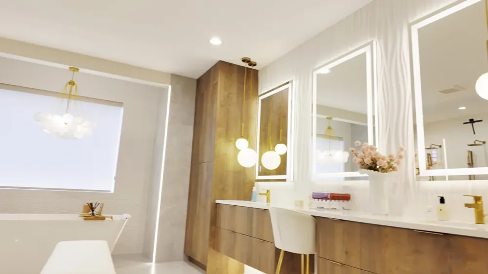 Primary bath vanity with lit mirrors