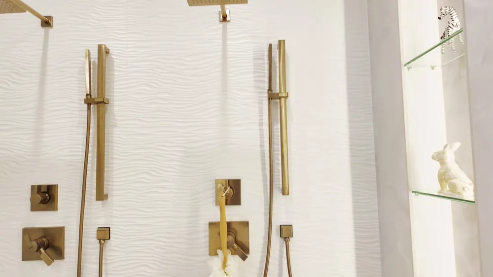 Walk-in shower with a gold rain shower head