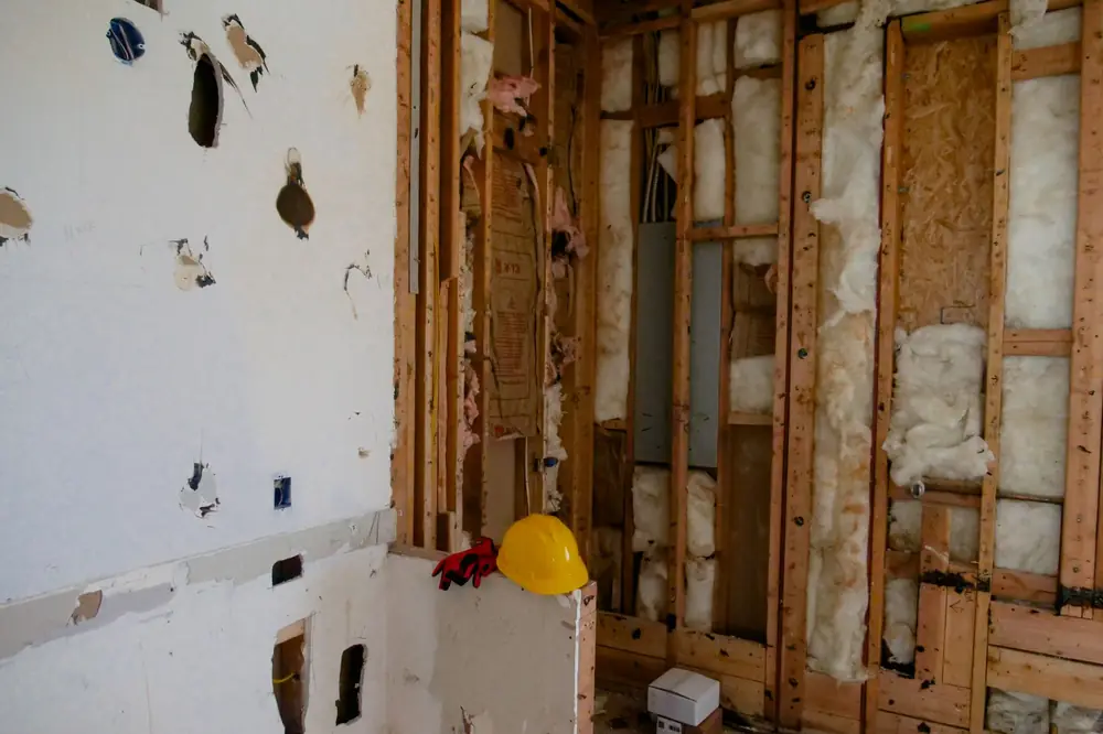 Wall opened down to the studs so the structure can dry